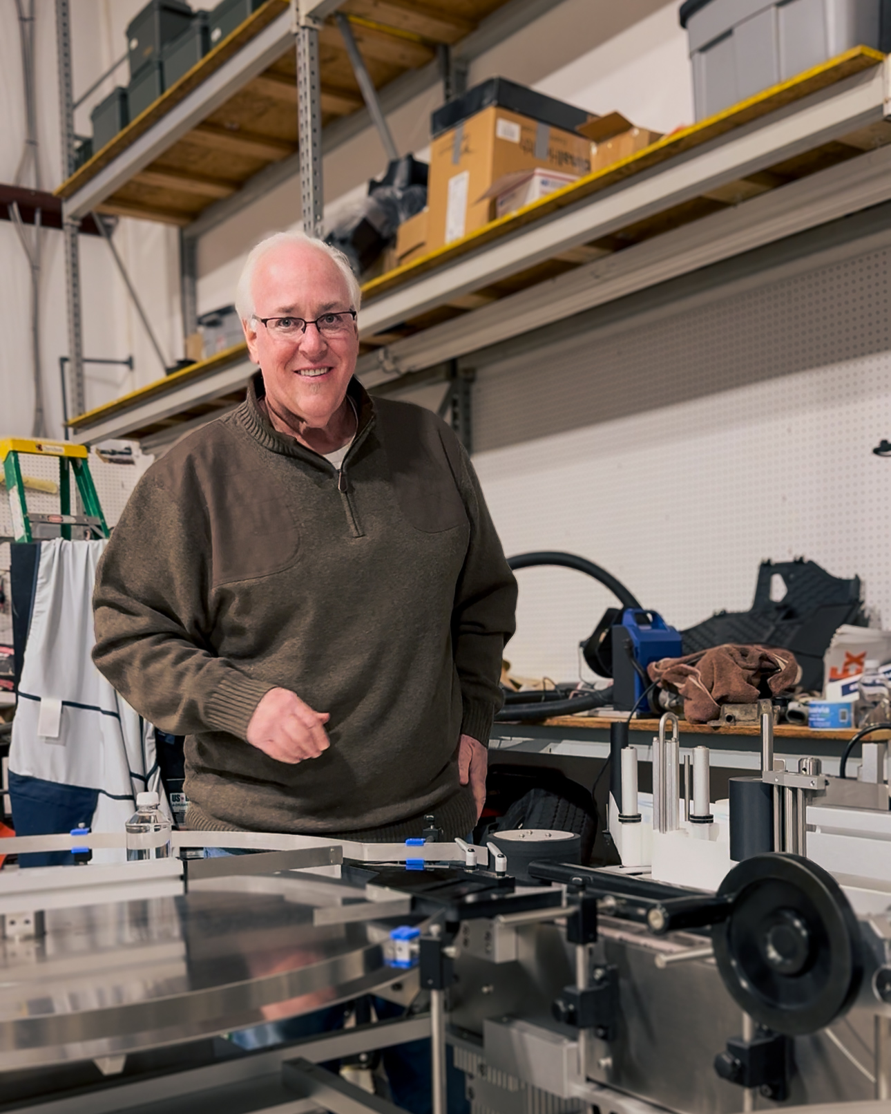 Joe Welch, CEO of IWantMYH2O. using the bottle labeling machine